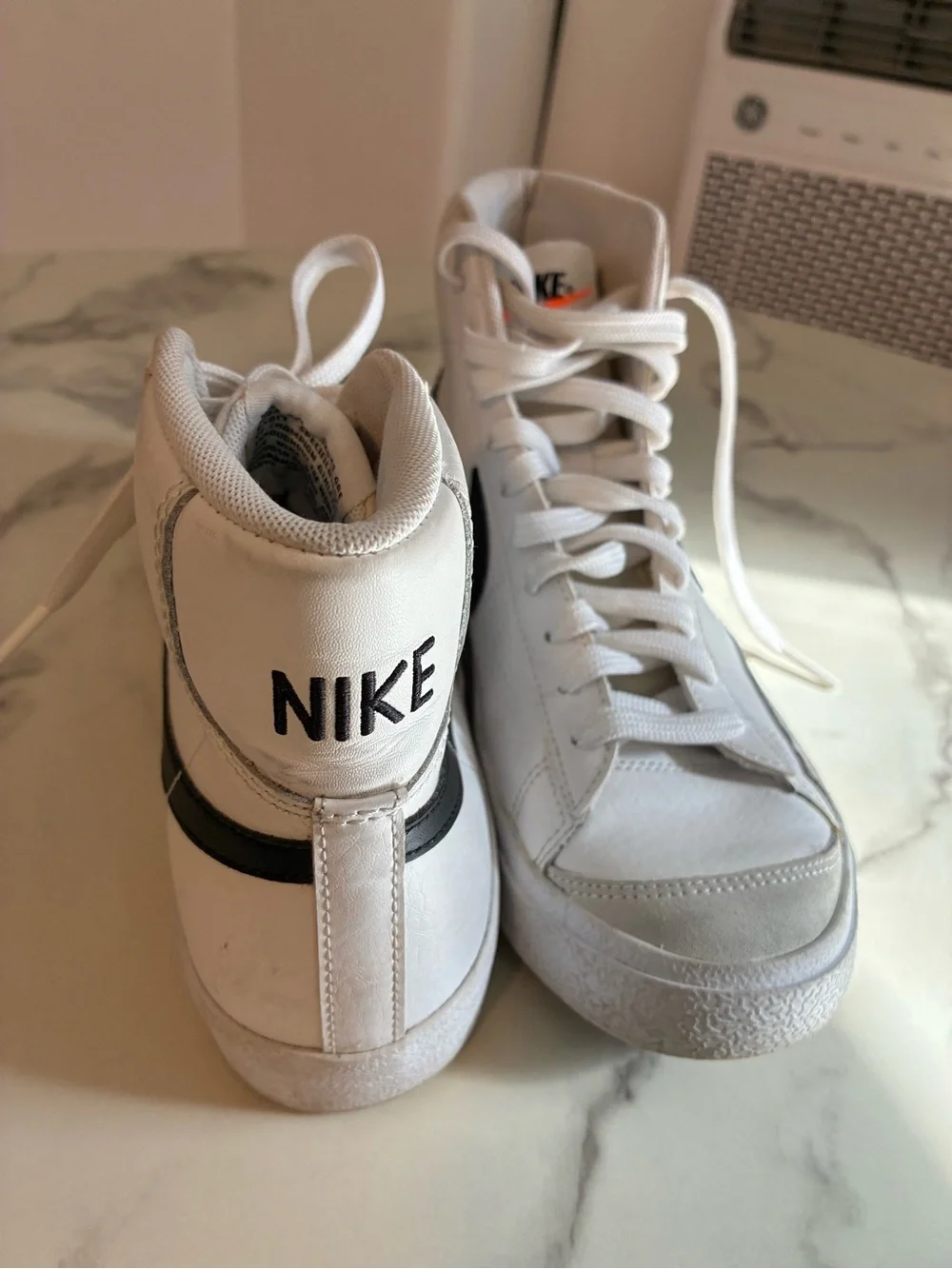 Nike White High-Top Sneakers with Black Swoosh Accent